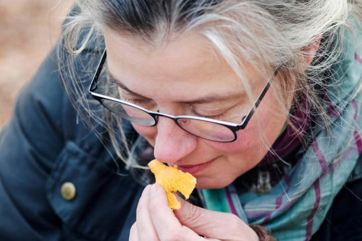 a woman eating a hot dog